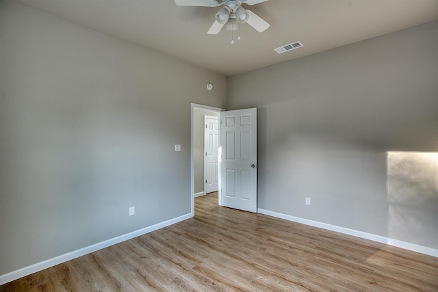 empty room featuring ceiling fan and light hardwood / wood-style floors