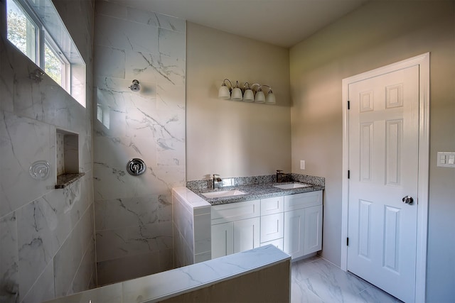 bathroom featuring vanity and a shower