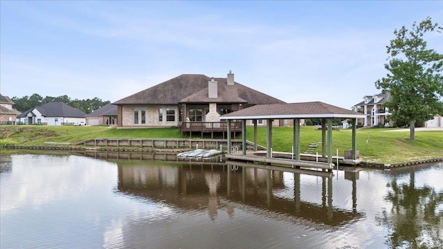 1215 Bourbon St, Bridge City, TX 77611 - dock with a water view and a lawn