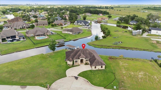 1215 Bourbon St, Bridge City, TX 77611 - aerial perspective of suburban area with a nearby body of water