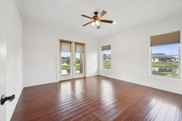1215 Bourbon St, Bridge City, TX 77611 - unfurnished room featuring a ceiling fan, french doors, hardwood / wood-style flooring, crown molding, and baseboards