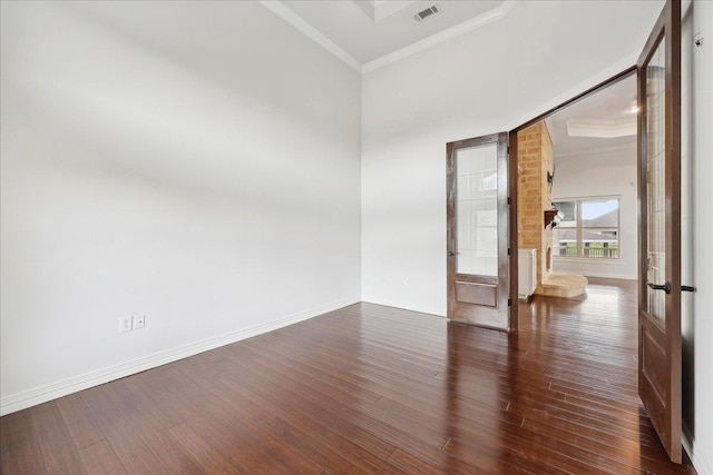 1215 Bourbon St, Bridge City, TX 77611 - spare room with french doors, ornamental molding, wood finished floors, and baseboards
