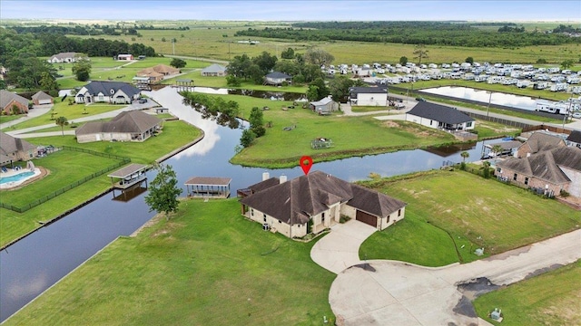1215 Bourbon St, Bridge City, TX 77611 - aerial view of residential area with a nearby body of water