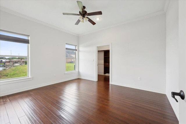 1215 Bourbon St, Bridge City, TX 77611 - spare room with a ceiling fan, baseboards, wood finished floors, and crown molding