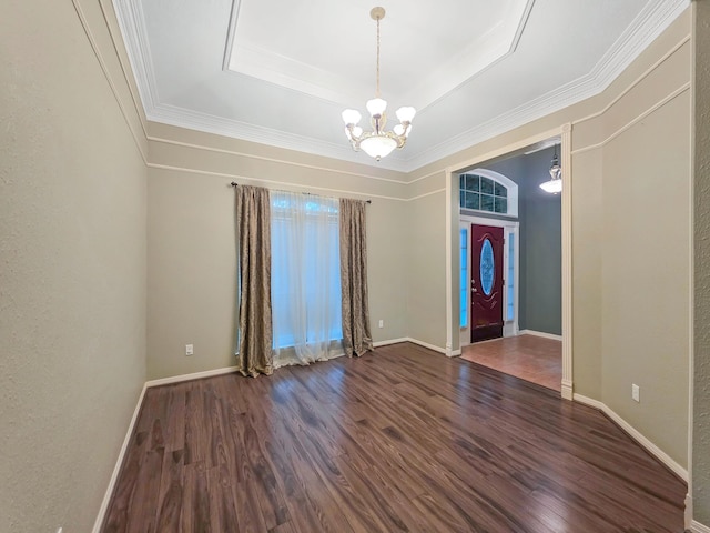 3760 Seminole Dr, Beaumont, TX 77707 - spare room with wood finished floors, a chandelier, a tray ceiling, baseboards, and ornamental molding