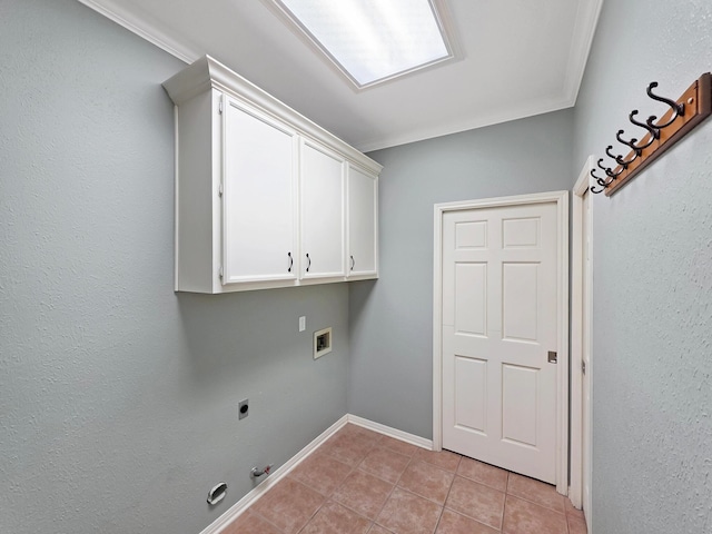 3760 Seminole Dr, Beaumont, TX 77707 - laundry area featuring electric dryer hookup, cabinet space, gas dryer hookup, washer hookup, and light tile patterned flooring