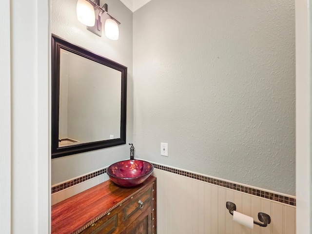 3760 Seminole Dr, Beaumont, TX 77707 - bathroom featuring vanity and wainscoting