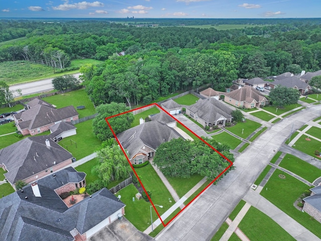 3760 Seminole Dr, Beaumont, TX 77707 - aerial perspective of suburban area featuring a heavily wooded area and property parcel outlined