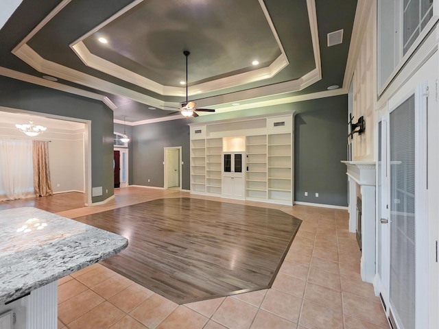 3760 Seminole Dr, Beaumont, TX 77707 - unfurnished living room with light tile patterned flooring, a tray ceiling, ornamental molding, baseboards, and ceiling fan