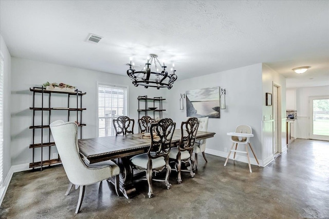 109 Twin Pines Cir, Beaumont, TX 77705 - dining space featuring baseboards, a chandelier, and finished concrete flooring