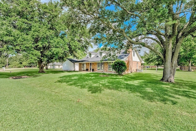 109 Twin Pines Cir, Beaumont, TX 77705 - view of front of home with brick siding and a front lawn