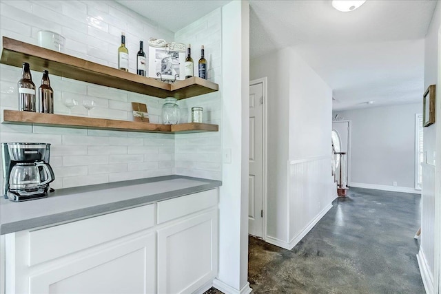 109 Twin Pines Cir, Beaumont, TX 77705 - indoor dry bar with backsplash and concrete flooring
