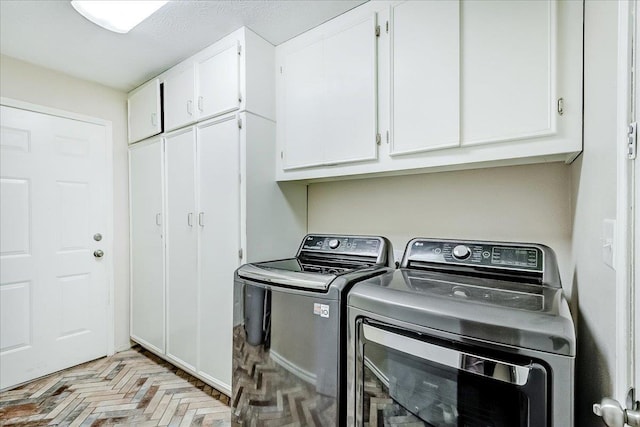 109 Twin Pines Cir, Beaumont, TX 77705 - laundry room with cabinet space and separate washer and dryer