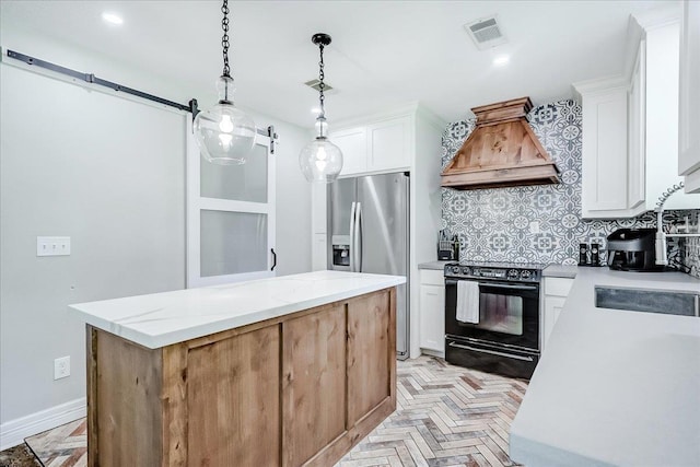 109 Twin Pines Cir, Beaumont, TX 77705 - kitchen with black range with electric cooktop, custom exhaust hood, stainless steel fridge, a center island, and backsplash
