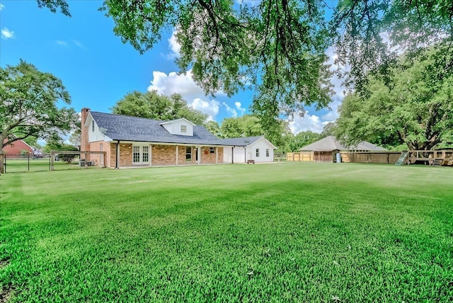109 Twin Pines Cir, Beaumont, TX 77705 - back of house with brick siding, a chimney, roof with shingles, and french doors