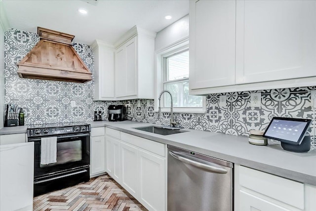 109 Twin Pines Cir, Beaumont, TX 77705 - kitchen featuring dishwasher, black range with electric stovetop, a sink, custom range hood, and light countertops
