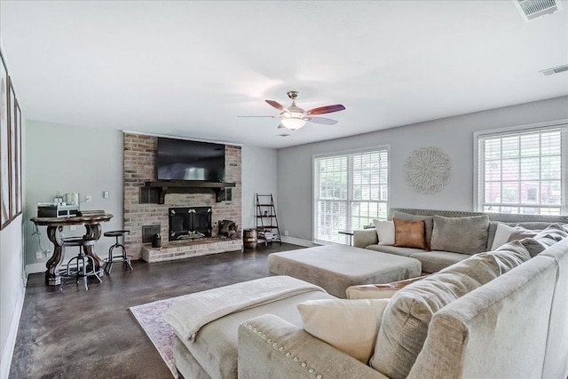 109 Twin Pines Cir, Beaumont, TX 77705 - living area with concrete flooring, a ceiling fan, a brick fireplace, and baseboards