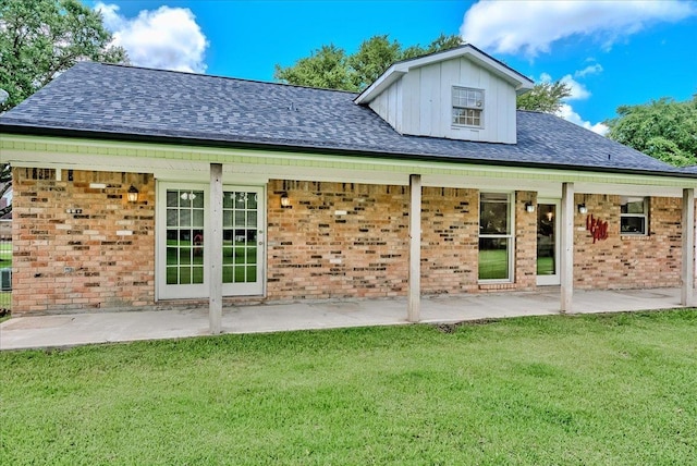 109 Twin Pines Cir, Beaumont, TX 77705 - rear view of property with brick siding and a yard
