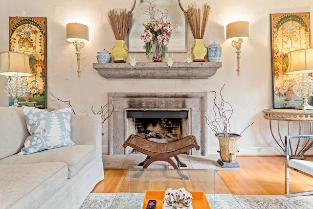 sitting room with hardwood / wood-style flooring