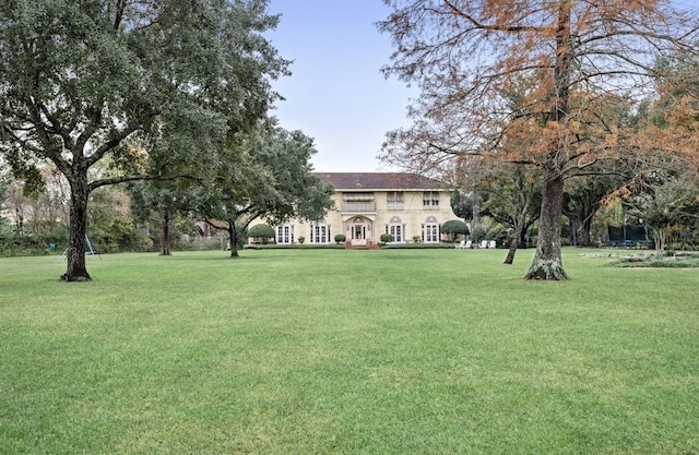 view of property's community with a yard