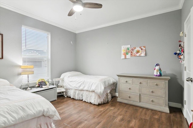 bedroom featuring dark hardwood / wood-style flooring, crown molding, and ceiling fan