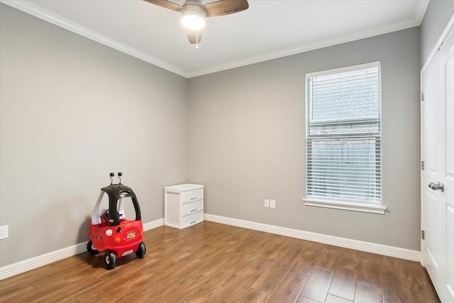 misc room with hardwood / wood-style floors, plenty of natural light, ornamental molding, and ceiling fan