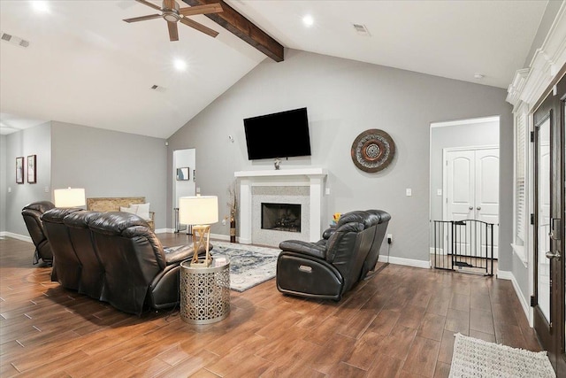 living room with ceiling fan, beam ceiling, and high vaulted ceiling