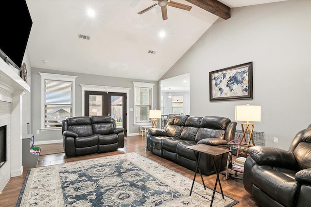 living room featuring french doors, wood-type flooring, high vaulted ceiling, beamed ceiling, and ceiling fan