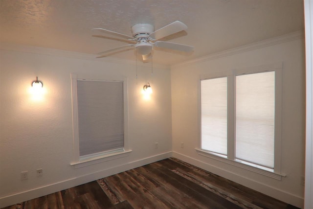empty room with a ceiling fan, crown molding, baseboards, and dark wood-type flooring