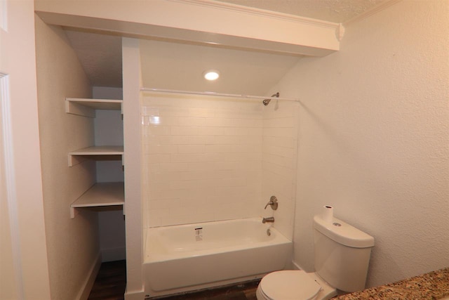 bathroom featuring toilet and bathtub / shower combination