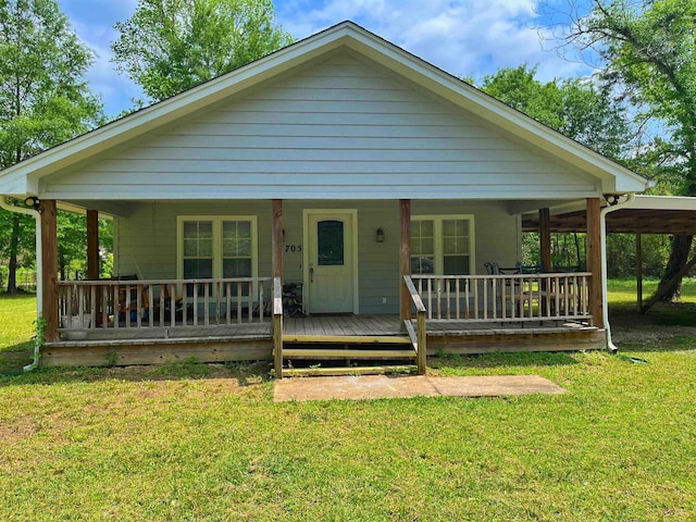 view of front of house featuring a front yard and covered porch