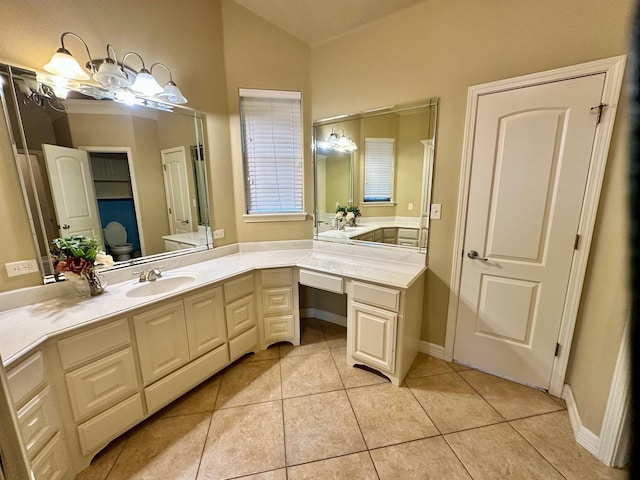 full bathroom with tile patterned flooring, vanity, and baseboards