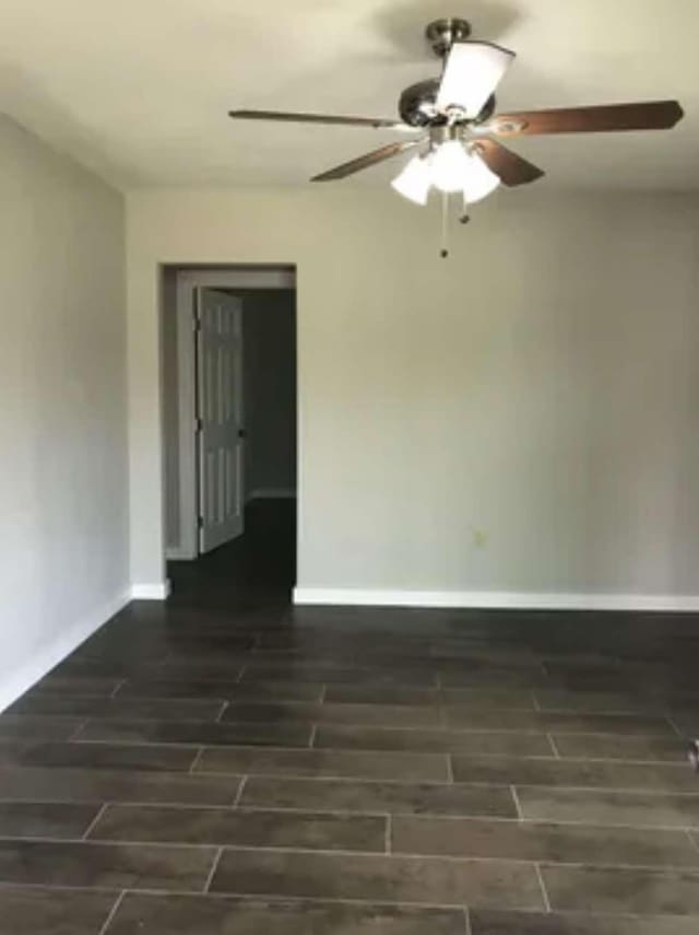 spare room with dark hardwood / wood-style flooring