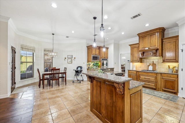 kitchen with recessed lighting, appliances with stainless steel finishes, brown cabinets, and tasteful backsplash