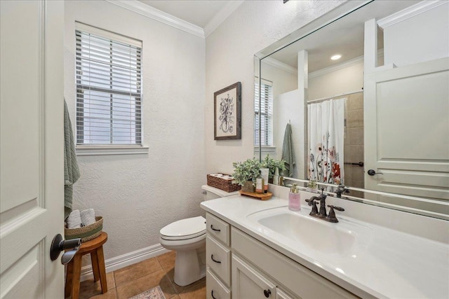 bathroom with crown molding, toilet, and a healthy amount of sunlight