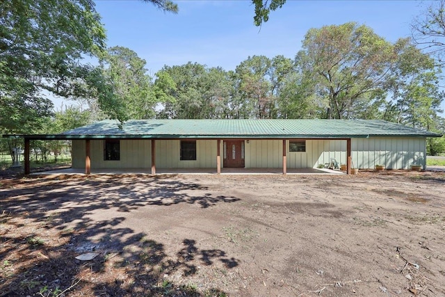 42252 State Highway 87, Orange, TX 77632 - view of front facade featuring a carport and board and batten siding