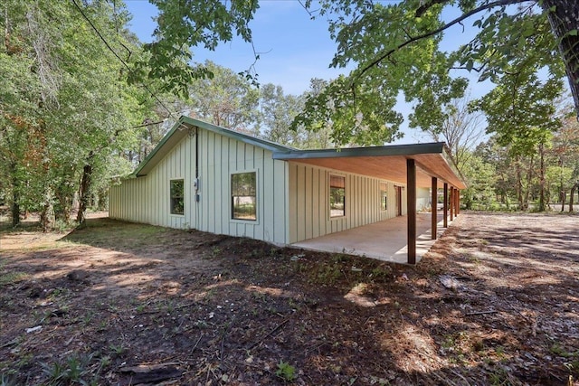 42252 State Highway 87, Orange, TX 77632 - view of side of home with board and batten siding and a patio area