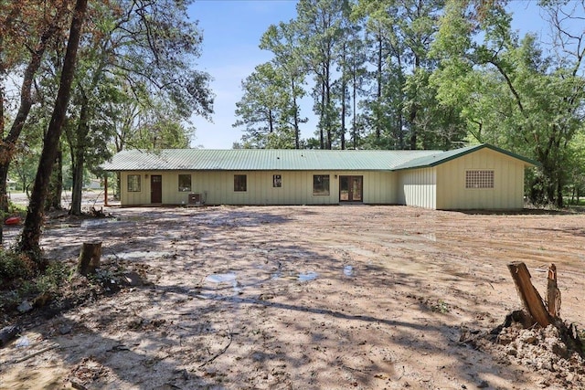 42252 State Highway 87, Orange, TX 77632 - ranch-style home featuring metal roof and cooling unit