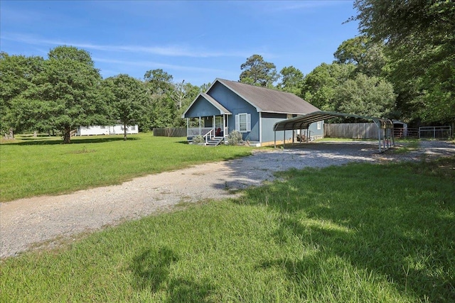664 W Tram Rd, Vidor, TX 77662 - view of front facade with driveway and a detached carport