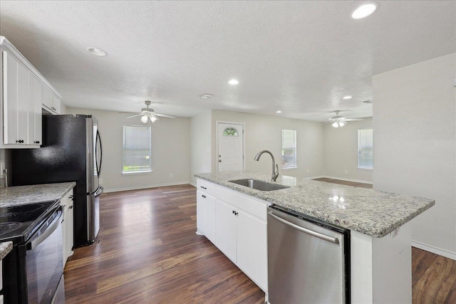 664 W Tram Rd, Vidor, TX 77662 - kitchen featuring dishwasher, ceiling fan, a sink, black electric range, and recessed lighting