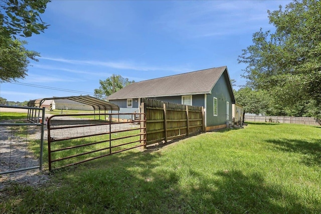 664 W Tram Rd, Vidor, TX 77662 - view of home's exterior featuring a detached carport