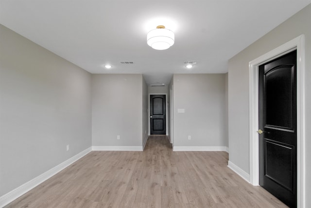 spare room with light hardwood / wood-style floors