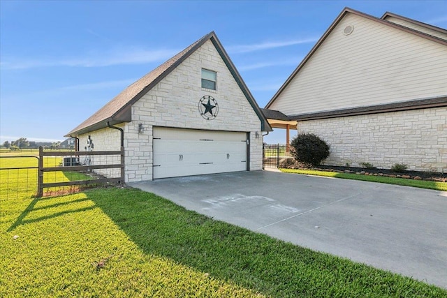 view of property exterior featuring a garage, an outdoor structure, and a lawn