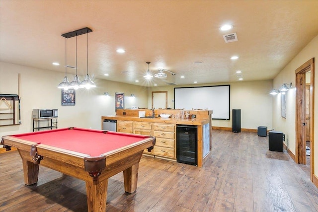 recreation room featuring pool table, wood-type flooring, beverage cooler, and indoor wet bar