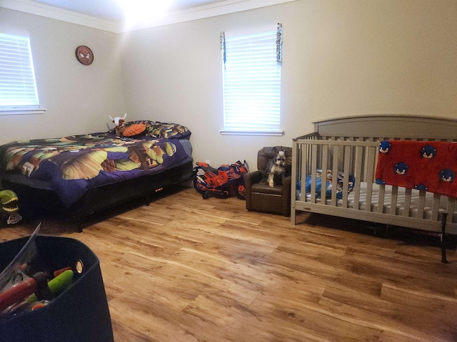 10848 Sandy Ln, Beaumont, TX 77705 - bedroom featuring wood finished floors and ornamental molding