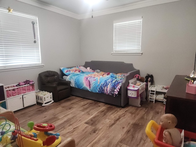 10848 Sandy Ln, Beaumont, TX 77705 - bedroom with crown molding and wood finished floors
