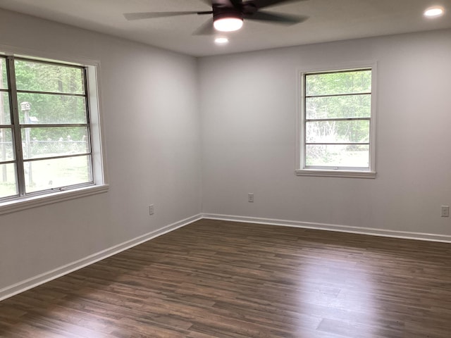 spare room with dark wood-style floors, ceiling fan, recessed lighting, and baseboards