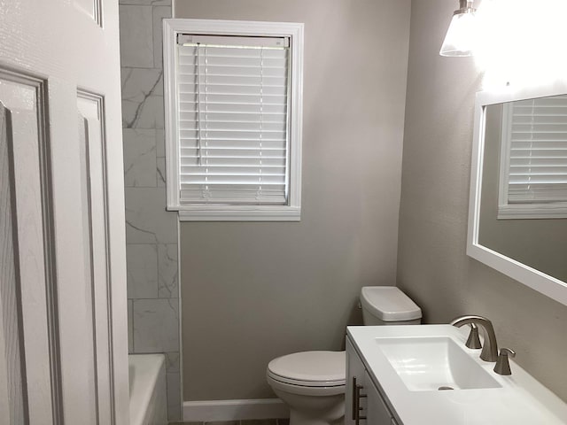 full bath with baseboards, toilet, and vanity