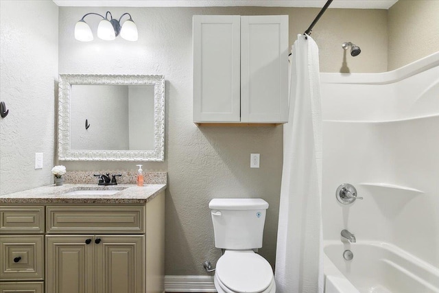 bathroom with toilet, vanity, a textured wall, and shower / bath combination with curtain