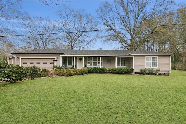 single story home with a garage and a front lawn